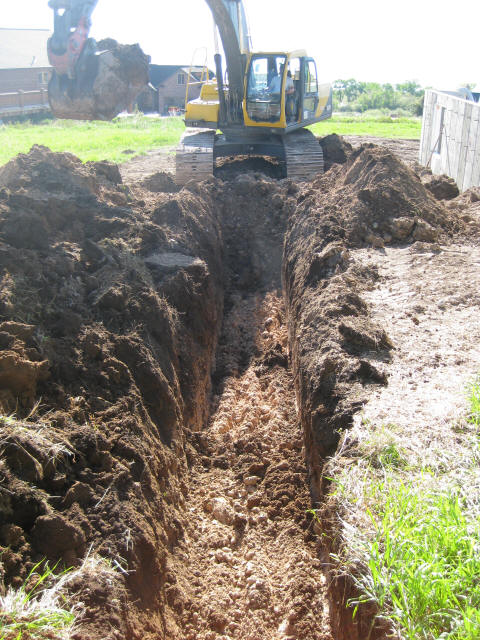 Trenching for geothermal pipe